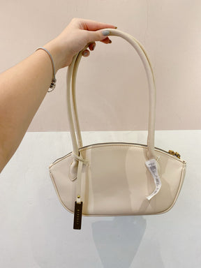 Bolsinha bege baguete C&A