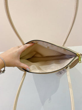 Bolsinha bege baguete C&A